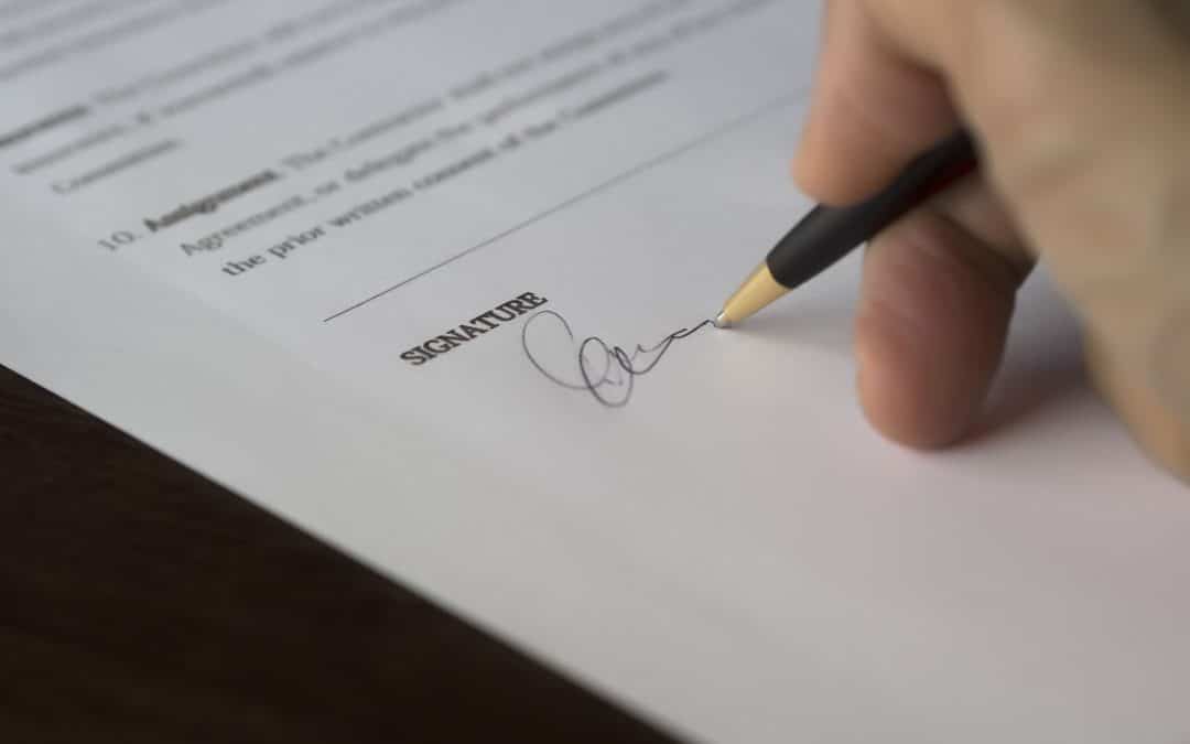 essential documents for estate planning person signing a document